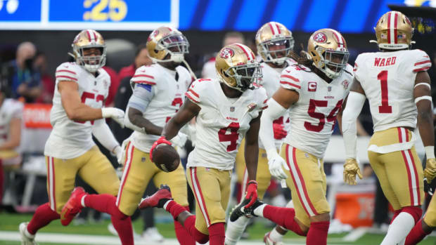 Detroit Lions cornerback Emmanuel Moseley celebrates an interception while playing for the San Francisco 49ers.
